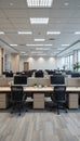 Spacious modern office interior with rows of empty workstations and natural light Royalty Free Stock Photo