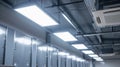 The bright overhead lights and large fans that provide ventilation and lighting in the locker room Royalty Free Stock Photo