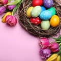 Bright painted eggs and spring tulips on pink background, flat lay with space for text. Happy Easter