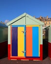 A bright painted holiday beach hut.