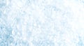 Bright pale blue surface completely covered with softly blurred crushed ice crystals, creating a cold winter background Royalty Free Stock Photo