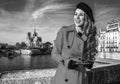 Tourist woman in Paris looking into distance and writing sms Royalty Free Stock Photo