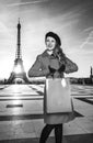 Young tourist woman with shopping bag in Paris looking aside Royalty Free Stock Photo