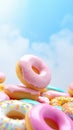 Bright pastel color frosted assorted donuts levitating, blue sky background