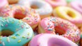 Bright pastel color frosted assorted donuts, sweet fun food sugar background