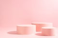 Bright pastel pink three different circle podiums in sunlight with shadow mockup for presentation cosmetic product or goods.