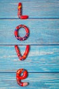 Bright pattern Love lettering with plasticine clay onblue wooden background. Love concept, saint valentines day Royalty Free Stock Photo