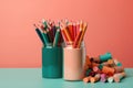 Bright pencils in holder and chalks isolated on colorful background. space for text. back to school