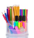 Bright pens, pencils and markers in holder