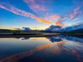 Bright pink blue sunset sky over a reflective pond in Eidsvoll, Norway Royalty Free Stock Photo