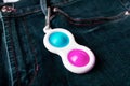 Bright pink and blue toy antistress for children and adults. Flexible sensory antistress toy - popit, simple dimple.