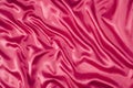 Bright pink, cerise silk folded fabric background Royalty Free Stock Photo