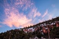 Bright pink clouds at sunset over orange sandstone cliffs in Utah Desert Royalty Free Stock Photo