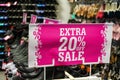 Bright pink Extra 20 percent off sale sign at shoe shop Royalty Free Stock Photo