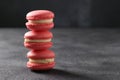 Bright pink french macaroons on dark gray background, Copy space Royalty Free Stock Photo