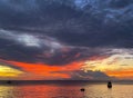 Brilliant fiery pink sunset at the tourist destination, Store Bay on Tobago island.