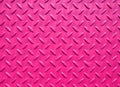 Pink painted industrial steel sheeting with grid textured flooring pattern