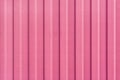 A bright pink painted sheet of corrugated metal. Abstract background for sites and layouts Royalty Free Stock Photo