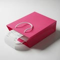 Pink shopping bag with a receipt peeking out on a white background gift bag paper bag Royalty Free Stock Photo