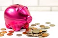 Bright pink pig money box for coins on light wall background with copy space. Economy, budget and savings concept. Royalty Free Stock Photo