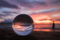 Bright Pink and Purple Seascape Sunset over Ocean with Glass Ball Royalty Free Stock Photo