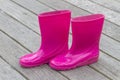 Bright pink rubber boots