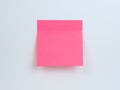 Bright pink sticky note on a plain background Royalty Free Stock Photo
