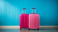Bright pink suitcases on vibrant blue backdrop, travel luggage set for vacation and adventures