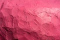 Bright pink wall with rough surface