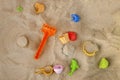 Bright plastic children`s toy in the sand. Children`s toys for t Royalty Free Stock Photo