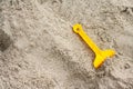 Bright plastic children`s toys in the sand. Royalty Free Stock Photo