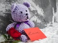 Bright plush toy, red rose and a note Royalty Free Stock Photo