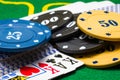 Bright poker chips and playing cards closeup Royalty Free Stock Photo