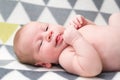 Bright portrait of cute 14 days newborn baby boy lying and smiling Royalty Free Stock Photo