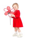 Bright portrait of playing adorable baby girl with red toy