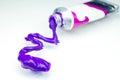 Bright purple Acrylic paint, extruded from the tube.