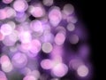 Bright purple blurred lights on a black background abstract Royalty Free Stock Photo