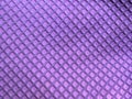 Repeated Fish Scale or Reptile Pattern on Bright Purple Rubber Textile. Use as Background. Royalty Free Stock Photo