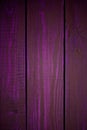 Bright purple wood texture as a background vignette texture Royalty Free Stock Photo