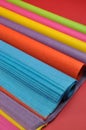 Bright rainbow colored reams (rolls) of tissue wrapping paper for gift wrapping - vertical Royalty Free Stock Photo