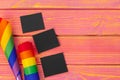 Bright rainbow gay flag on wooden background and blank space Royalty Free Stock Photo