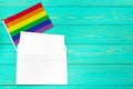 Bright rainbow gay flag on wooden background and blank space Royalty Free Stock Photo