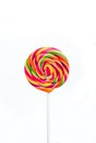 Bright rainbow round lollipop. Isolated on white background Royalty Free Stock Photo