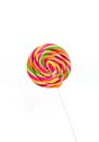 Bright rainbow round lollipop. Isolated on white background Royalty Free Stock Photo