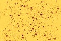 Bright random round paint splashes on yellow background. Abstract colorful texture