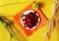 Bright raspberries on a yellow background Royalty Free Stock Photo