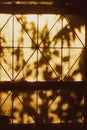 The bright rays of the sun illuminate the room through the old window of house in the morning Royalty Free Stock Photo