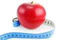 Bright red apple and measuring tape Royalty Free Stock Photo