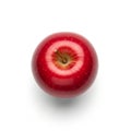 A bright red apple is shown against a white background, creating a stark contrast. The apple is Royalty Free Stock Photo