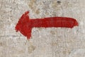 Bright red arrow on grange wall